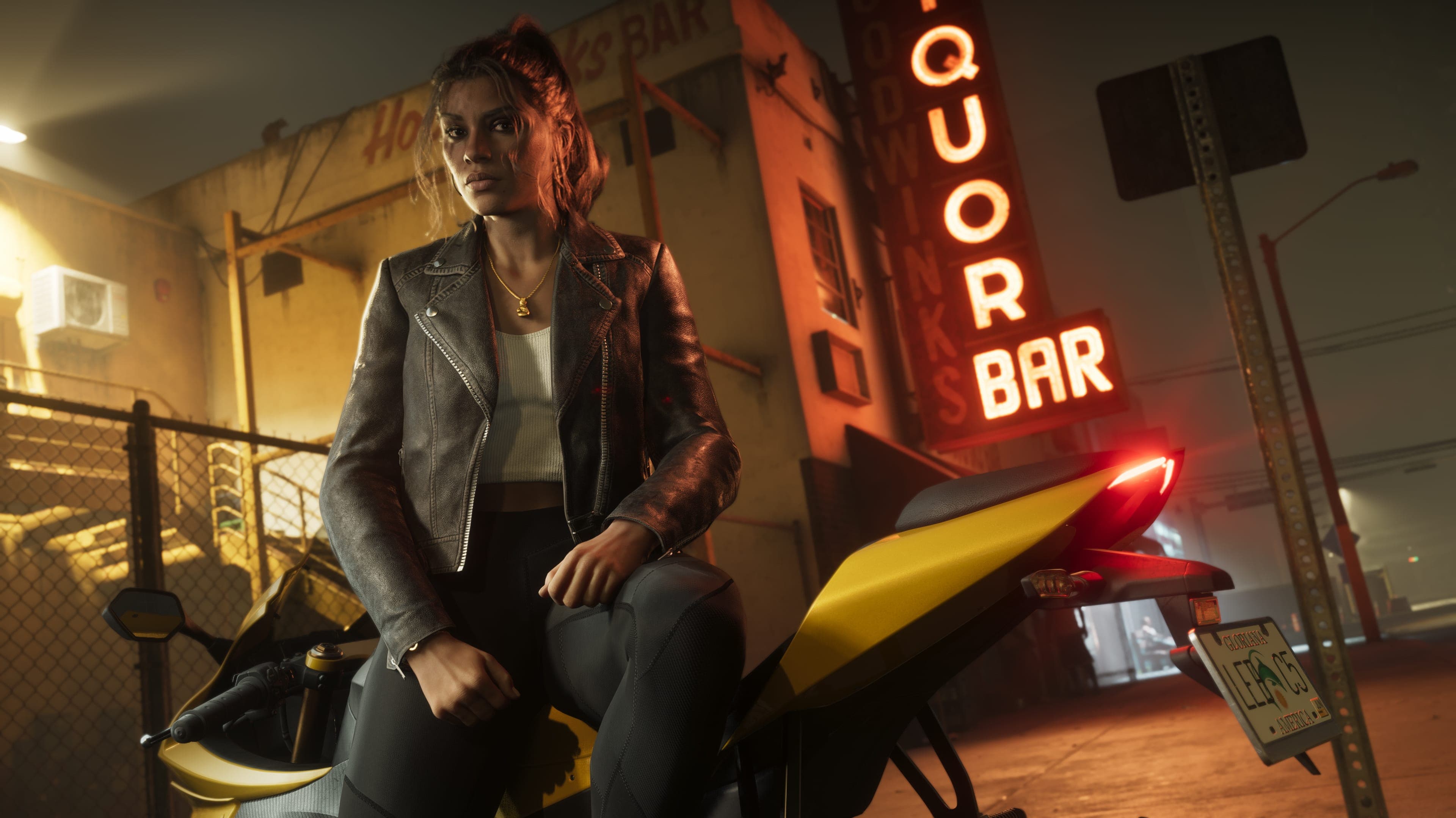 Lucia Caminos beside a motorcycle at night — official Rockstar Games screenshot